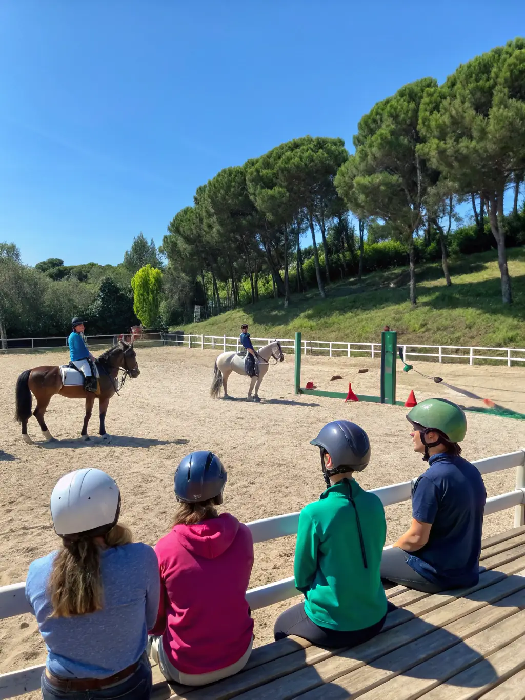 A scenic shot of a western riding clinic in progress, showcasing riders of various skill levels participating in a training session on the Plateau de Millevaches.