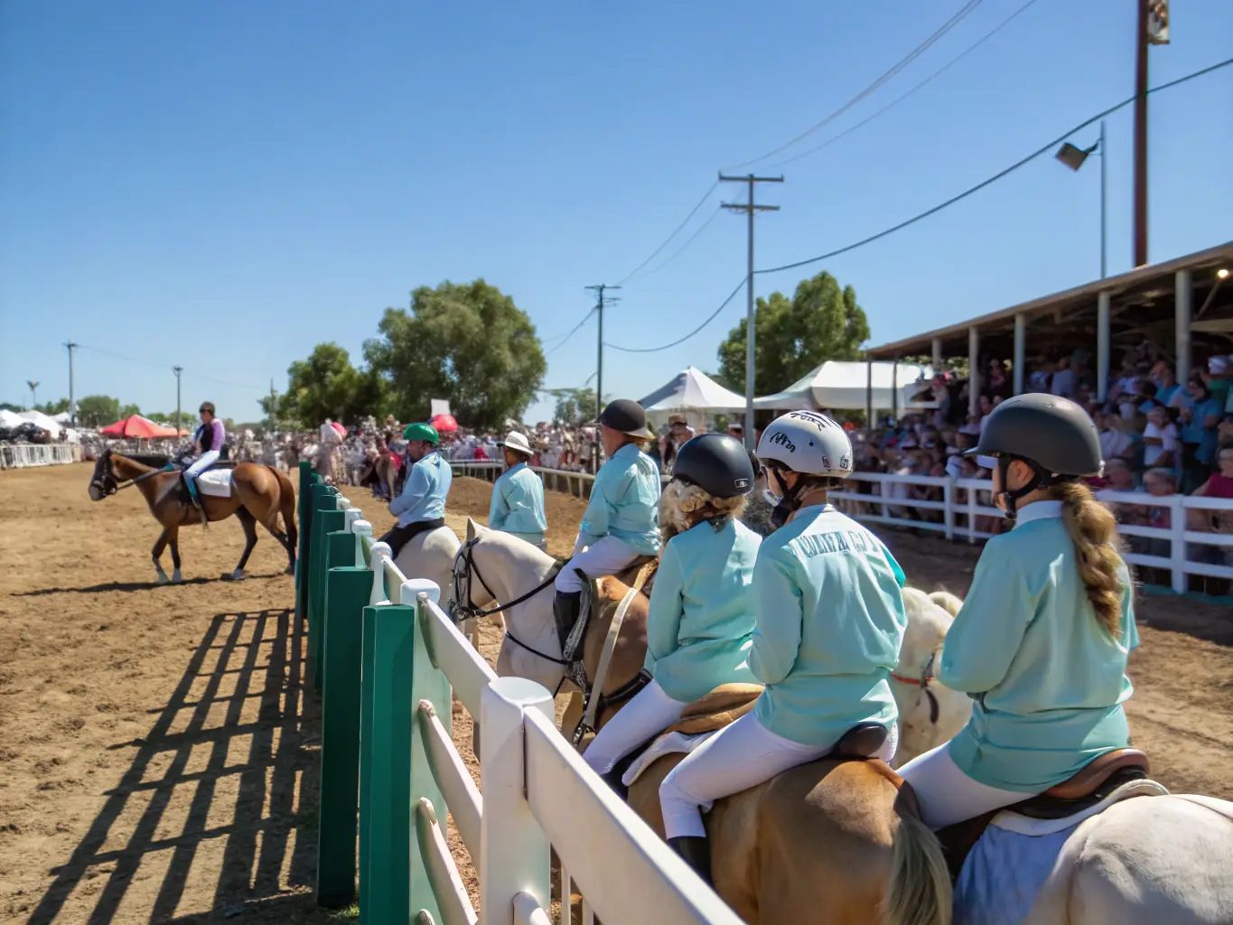 A community event showcasing western riding demonstrations and competitions, with families and spectators enjoying the festivities in a rural setting.